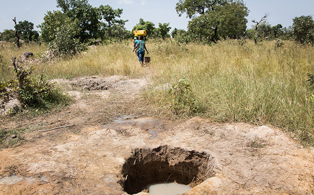 Villagers in Imbina, Burkina Faso struggle to find a place where a hand-dug well yields water, often digging up to four metres deep. Photo credit: WaterAid/ Andrew McConnell