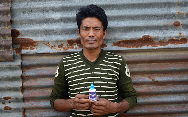 Man holds water bottle